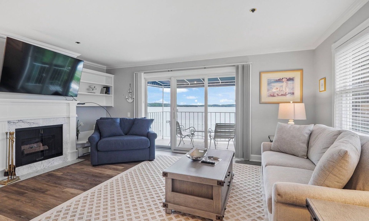 Boyne City Condo | 215 Water Street | Balcony Over Lake Charlevoix | Waterfront Stay | Fireplace