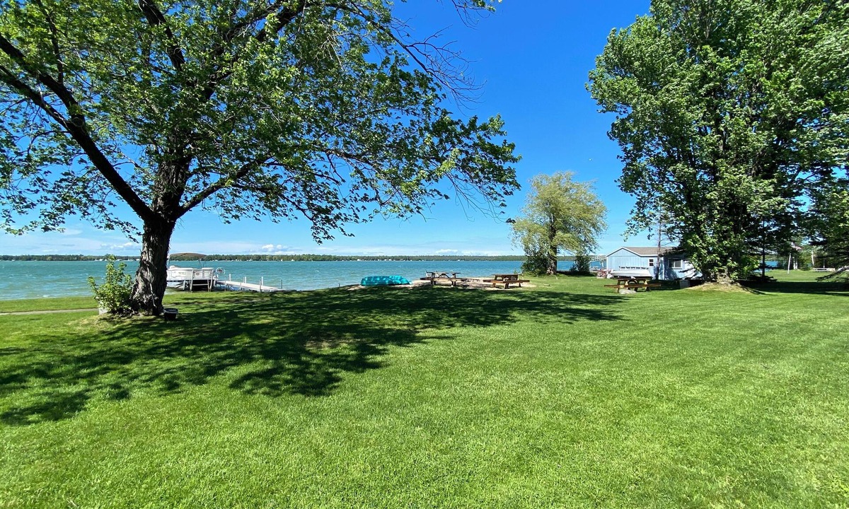 Presque Isle Resort | 3 lakefront cottages private yard and beach with dock.