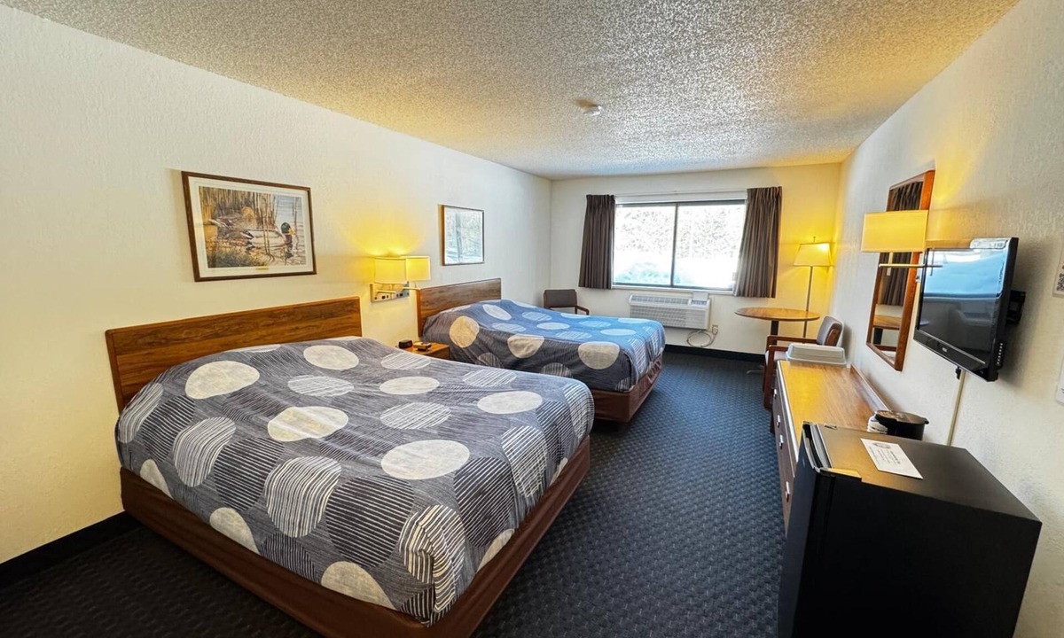 Boulder Junction Apartment | A dog friendly room with two queen beds, private bathroom, mini fridge, and single-serve coffee maker.