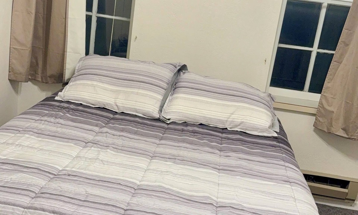 Spillville Apartment | Room 5: Sleep Where Prohibition Secrets Were Made - Historic Escape!