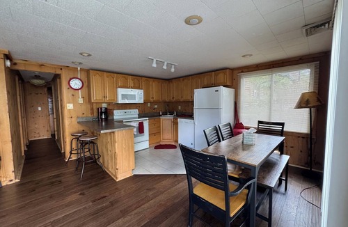Presque Isle Cottage | 2 lakefront cottages private beach & dock.