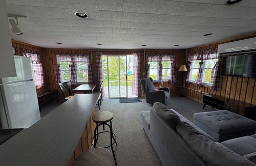 Presque Isle Cottage | 2 lakefront cottages private beach & dock.