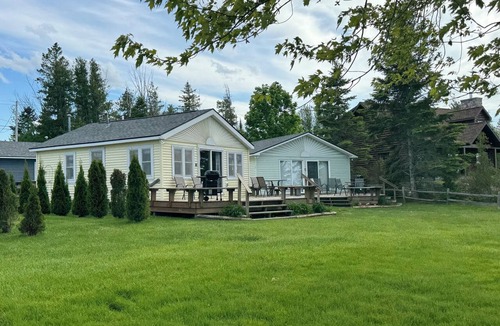 Presque Isle Cottage | 2 lakefront cottages private beach & dock.
