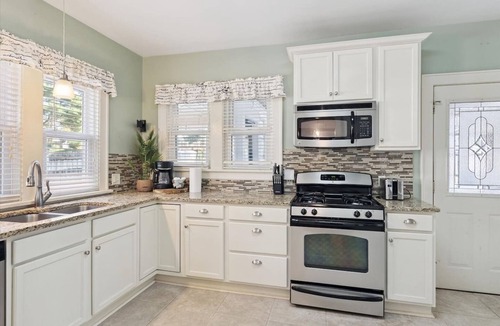 John Ball Park House | 5BR/3BA Near Downtown & Medical Mile Fenced Yard