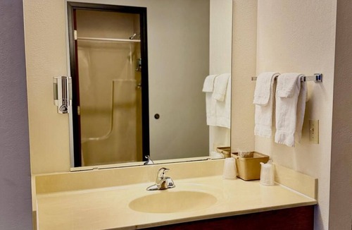 Boulder Junction Apartment | A dog friendly room with two queen beds, private bathroom, mini fridge, and single-serve coffee maker.