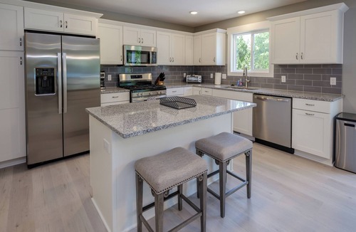 South Haven House | Beautiful new 6 bedroom with heated pool, fire pit and private setting