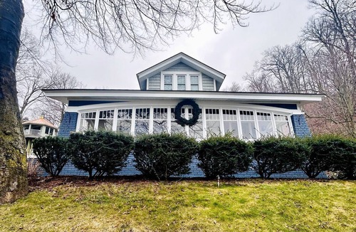 Macatawa Cottage | Charming Waterfront Cottage with Modern Remodel Overlooking Lake Macatawa Harbor, Near Macatawa, Michigan