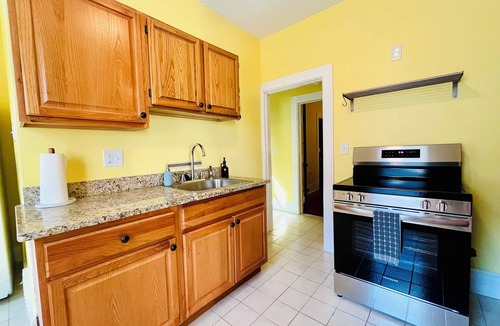 Ypsilanti Apartment | Cheerful 2BR apt, historic home near EMU and U-M, walkable area. Dog friendly!