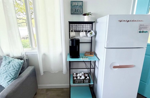 Cadillac Cottage | Cozy Blue Cottage on Stone Ledge Lake