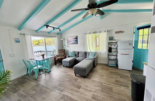 Cadillac Cottage | Cozy Blue Cottage on Stone Ledge Lake