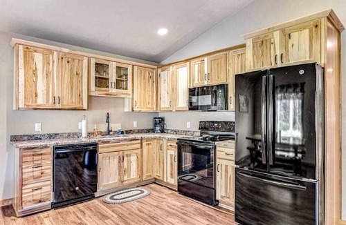 Conover House | Dog-friendly cabin with hot tub, fireplace, patio, grill, central AC, & W/D