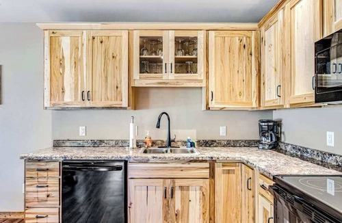 Conover House | Dog-friendly cabin with hot tub, fireplace, patio, grill, central AC, & W/D