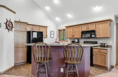 Necedah House | Dog-friendly riverfront retreat with huge yard, deck, grill, firepit, & kayaks