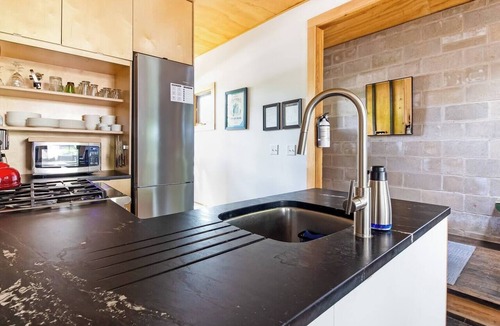 Douglas House | Douglas Hideaway | Modern home w/Hot Tub & Patio