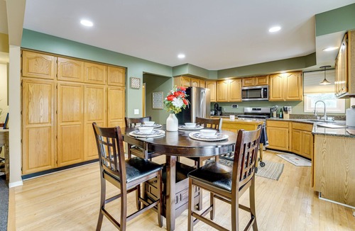 Commerce Township House | Game Room & Fire Pit: Canal-Front Commerce Home
