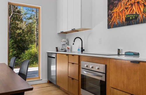 Acme House | KOTI 8 (Three Bedroom) Traverse City's Scandinavian Cabins, vacation home on TART & mins to Traverse.