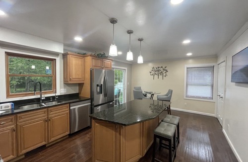 Racine House | Lake Michigan Retreat. Spacious 4-bedroom home on wooded lot across from lake.