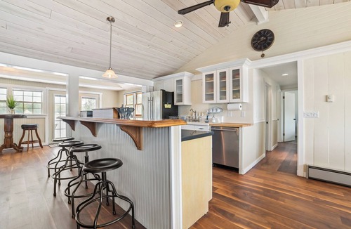Gladwin Cottage | Lakefront Gladwin Vacation Rental w/Deck & Dock!