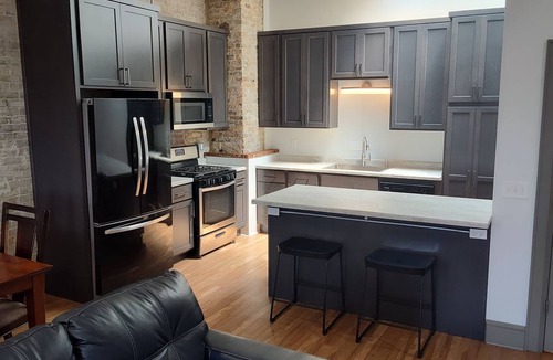 Oshkosh Apartment | Lovely 2nd floor apartment with private rooftop deck near the river on S Main