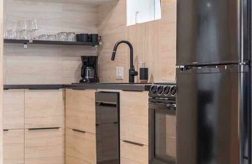 Aksarben - Elmwood Park Apartment | Luxury King Studio with Hot Tub & Heated Floors!