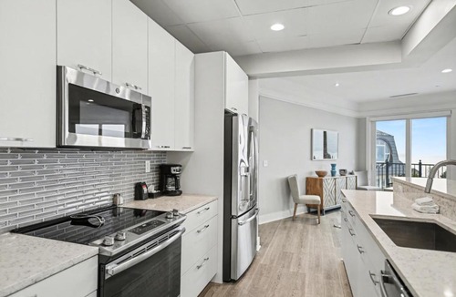 Bay Harbor Apartment | Modern Bliss 466: Luxurious 3BR condo in Bay Harbor with stunning lake views.