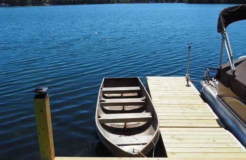 Mancelona Ski Chalet | NEW! Woods and Waters - Large, Family-Friendly, and Lakefront with Watercraft!