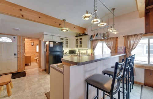 Carp Lake Cottage | Private Dock & Views! Family Home on Paradise Lake