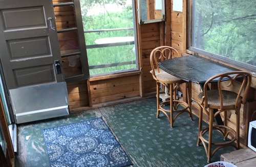 Mesick Cabin | Rustic Treehouse on fabulous private boating, fishing and swimming lake