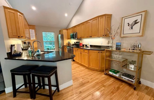 Fennville House | Upscale Wooded Retreat: Heated Pool, Hot tub, Fenced Yard & Game Room.