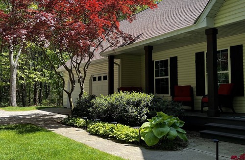 Fennville House | Upscale Wooded Retreat: Heated Pool, Hot tub, Fenced Yard & Game Room.