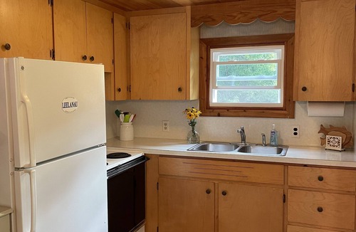 Lake Leelanau Cottage | Waterfront, peaceful, cozy, cottage w/dock amazing sunsets, kayaks,3 bed/2 bath.