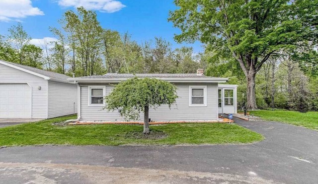 Charming home with sunroom, large yard, full kitchen, & washer/dryer