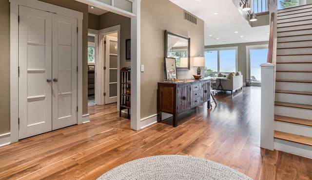 Stunning lakefront home & guest house with pool, beach, terraces, & views