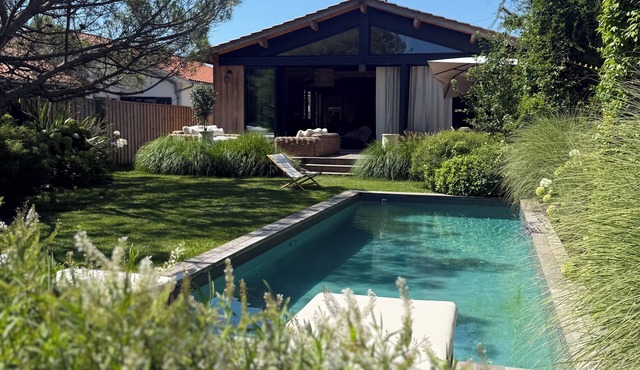 Villa and outbuilding with pool and garden